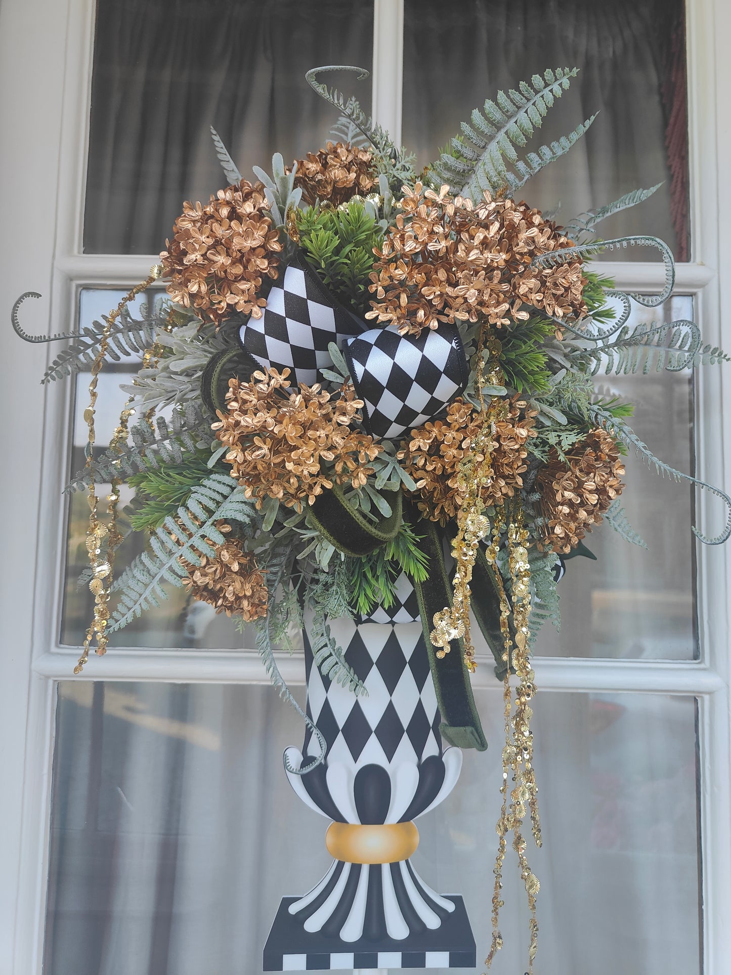 Vase wreath wall decor Mackenzie Childs style vibes Christmas swag