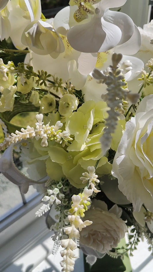 White flower arrangement candlestick tall centrepiece peonies hydrangea orchids ivory artificial flowers