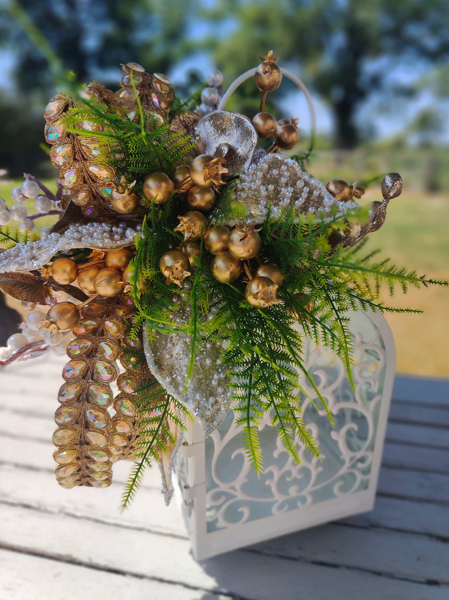 Lantern white and gold decorated tablecentre display. Gold and white lantern. Home decor arrangement