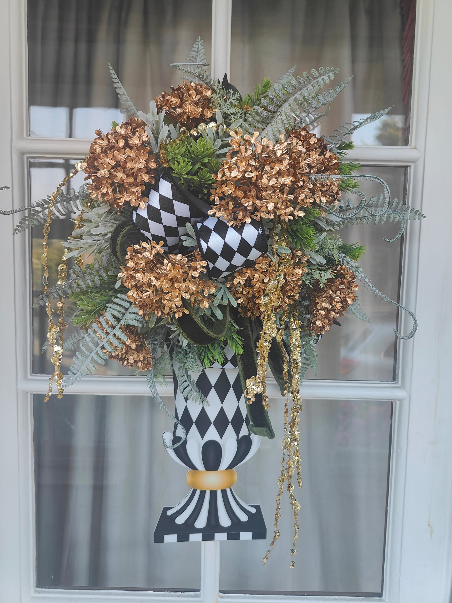 Vase wreath wall decor Mackenzie Childs style vibes Christmas swag