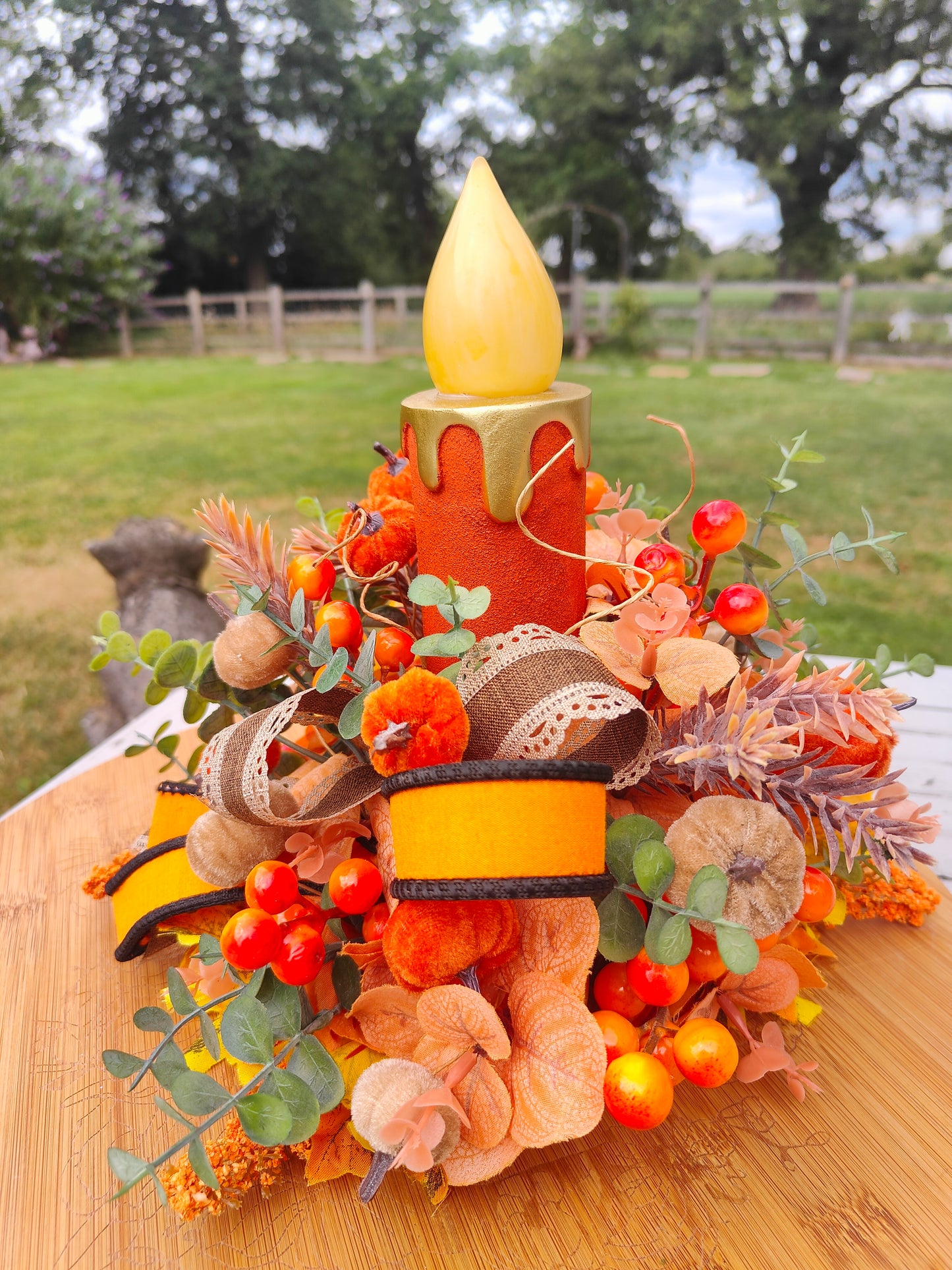 Autumn candle tablecentre arrangement lights up