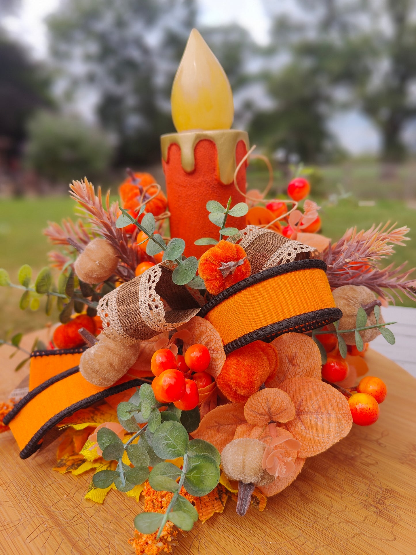 Autumn candle tablecentre arrangement lights up