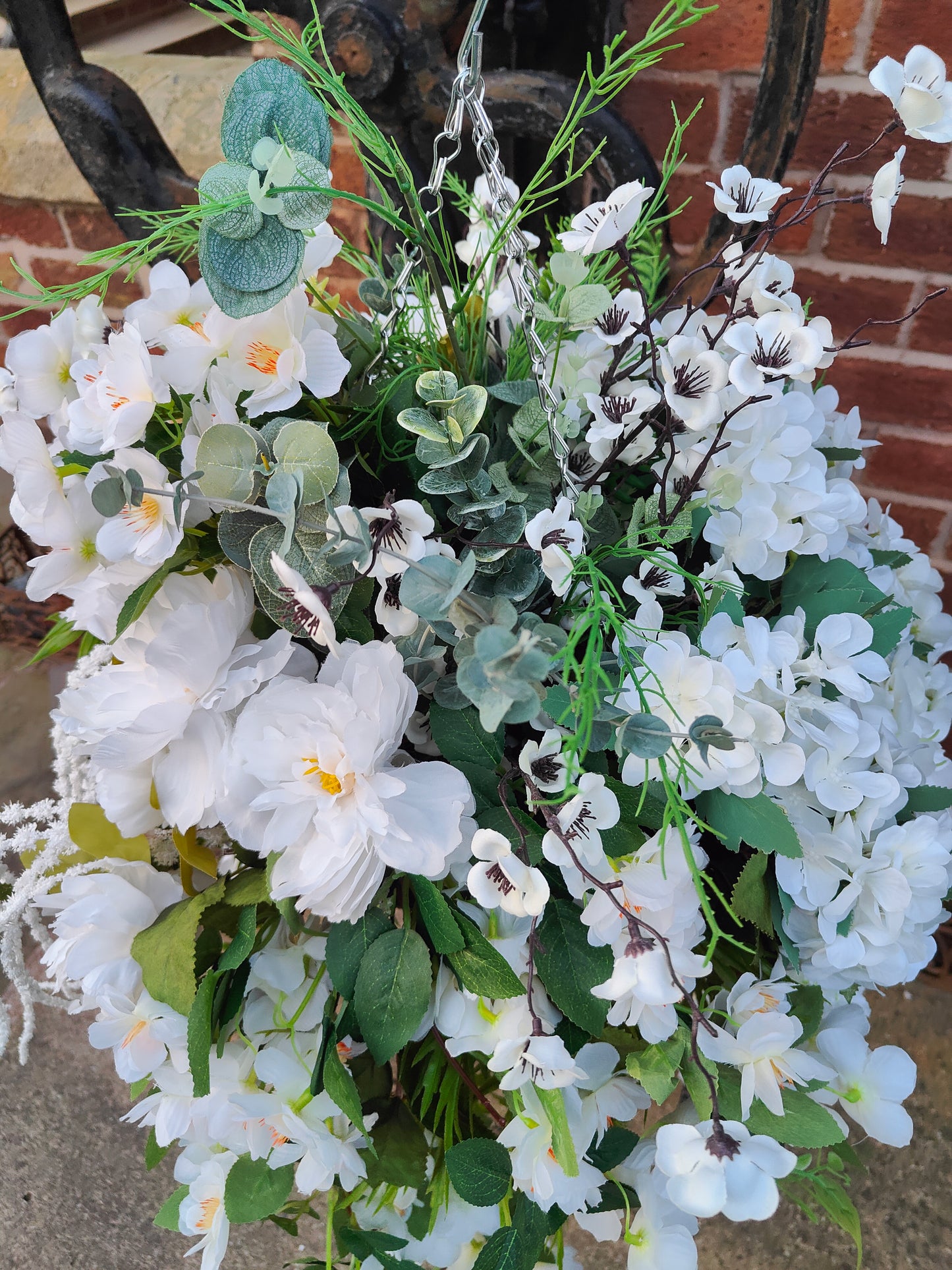 Hanging basket very large white artificial flowers cone
