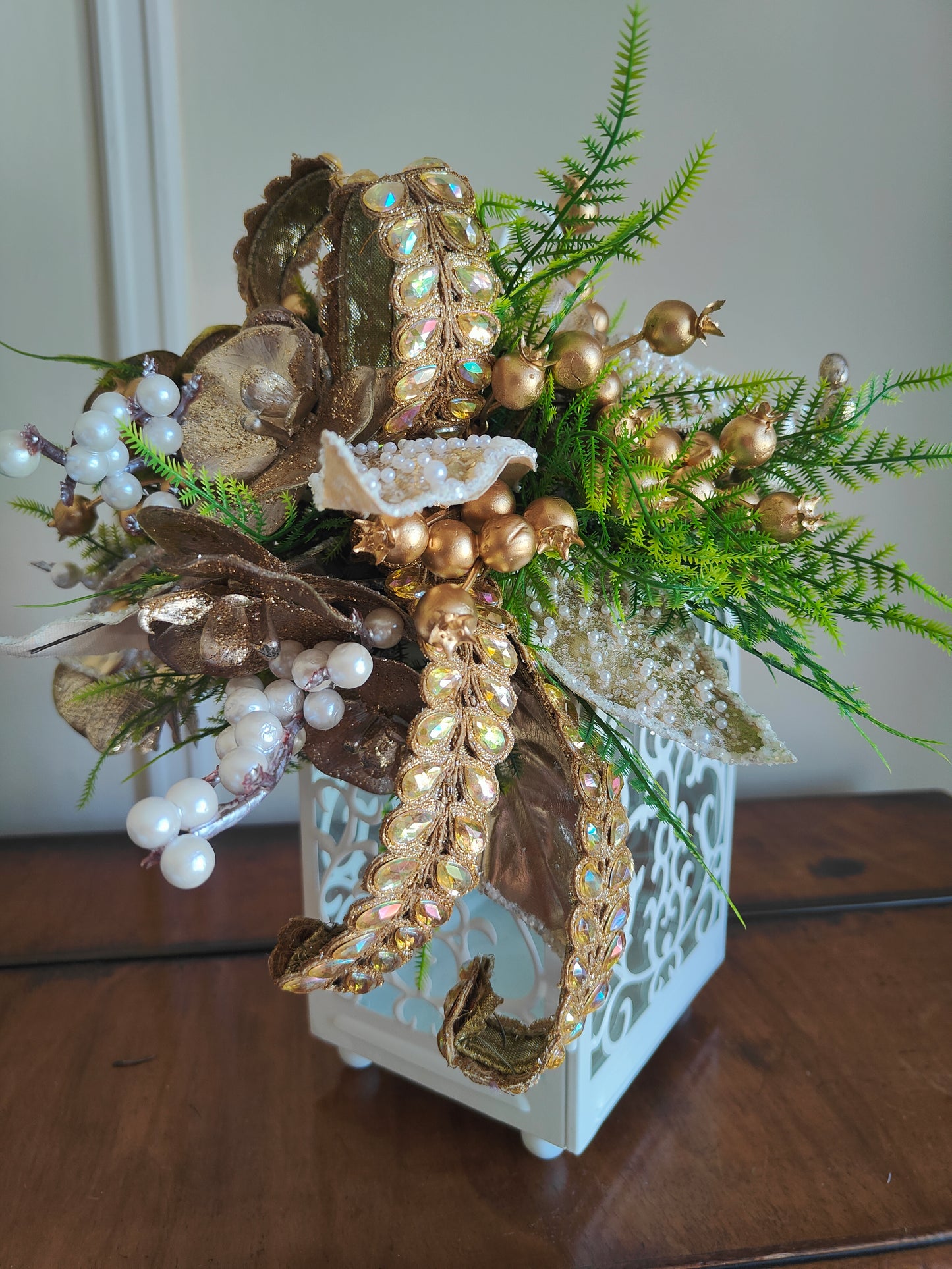 Lantern white and gold decorated tablecentre display. Gold and white lantern. Home decor arrangement