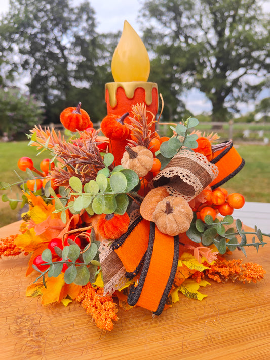 Autumn candle tablecentre arrangement lights up