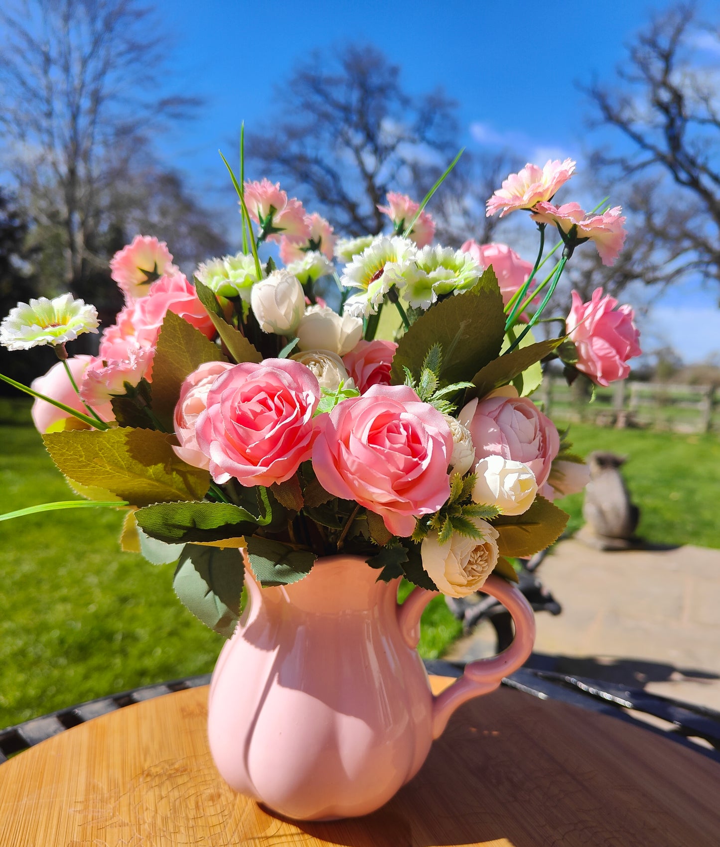 Flower arrangement artificial pink roses ranunculus in ceramic pink jug by Price & Kensington vintage