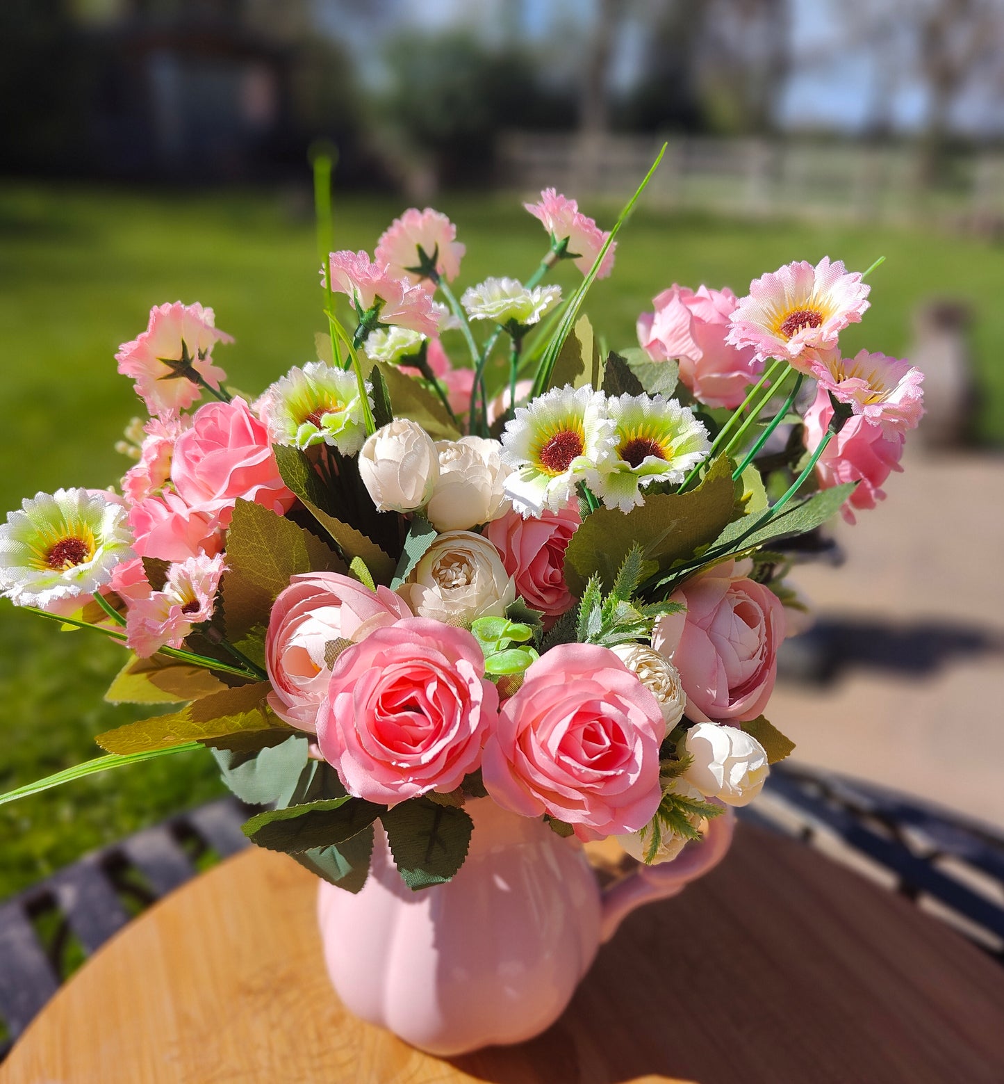 Flower arrangement artificial pink roses ranunculus in ceramic pink jug by Price & Kensington vintage
