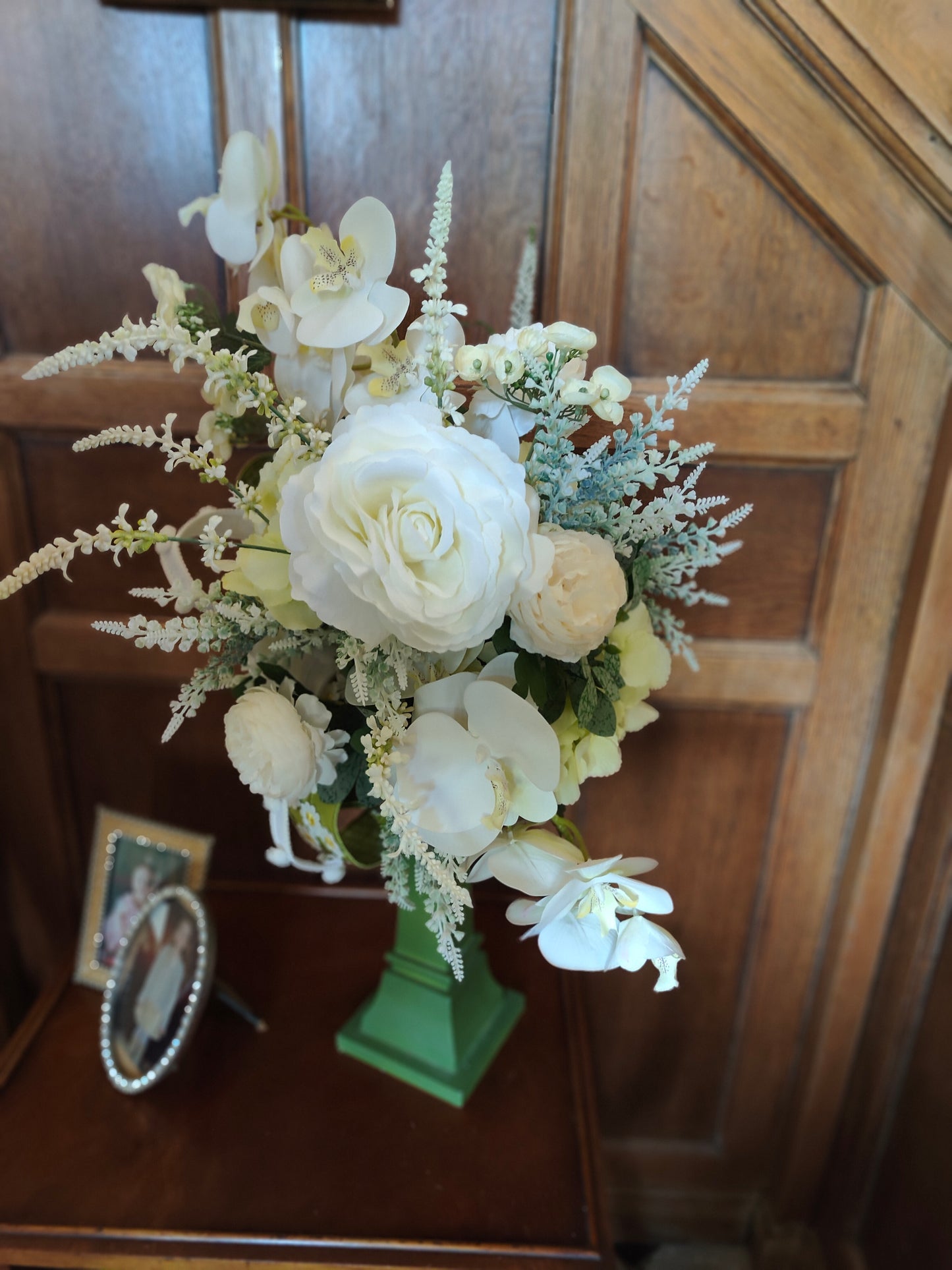 White flower arrangement candlestick tall centrepiece peonies hydrangea orchids ivory artificial flowers