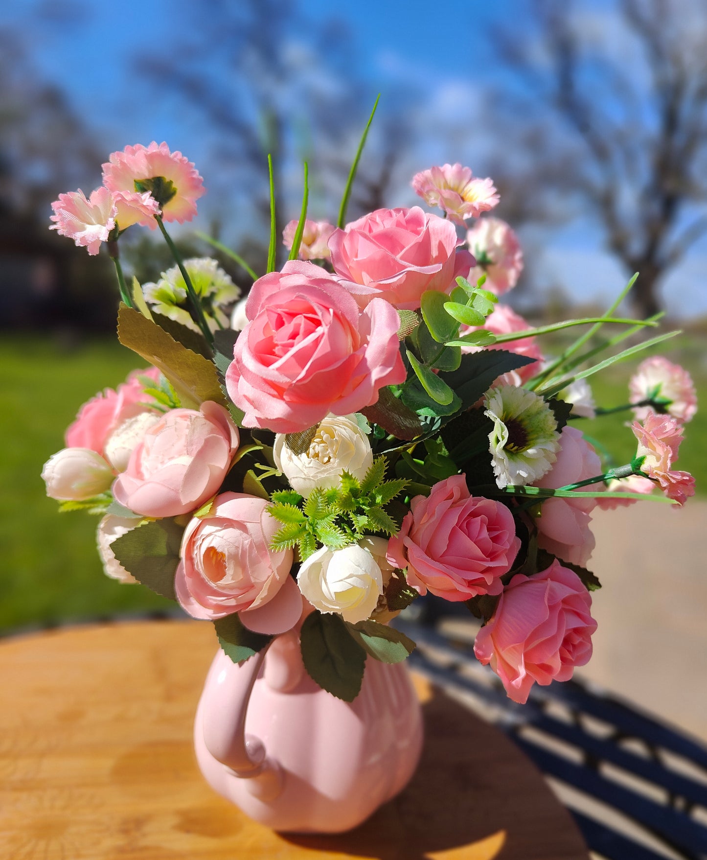 Flower arrangement artificial pink roses ranunculus in ceramic pink jug by Price & Kensington vintage