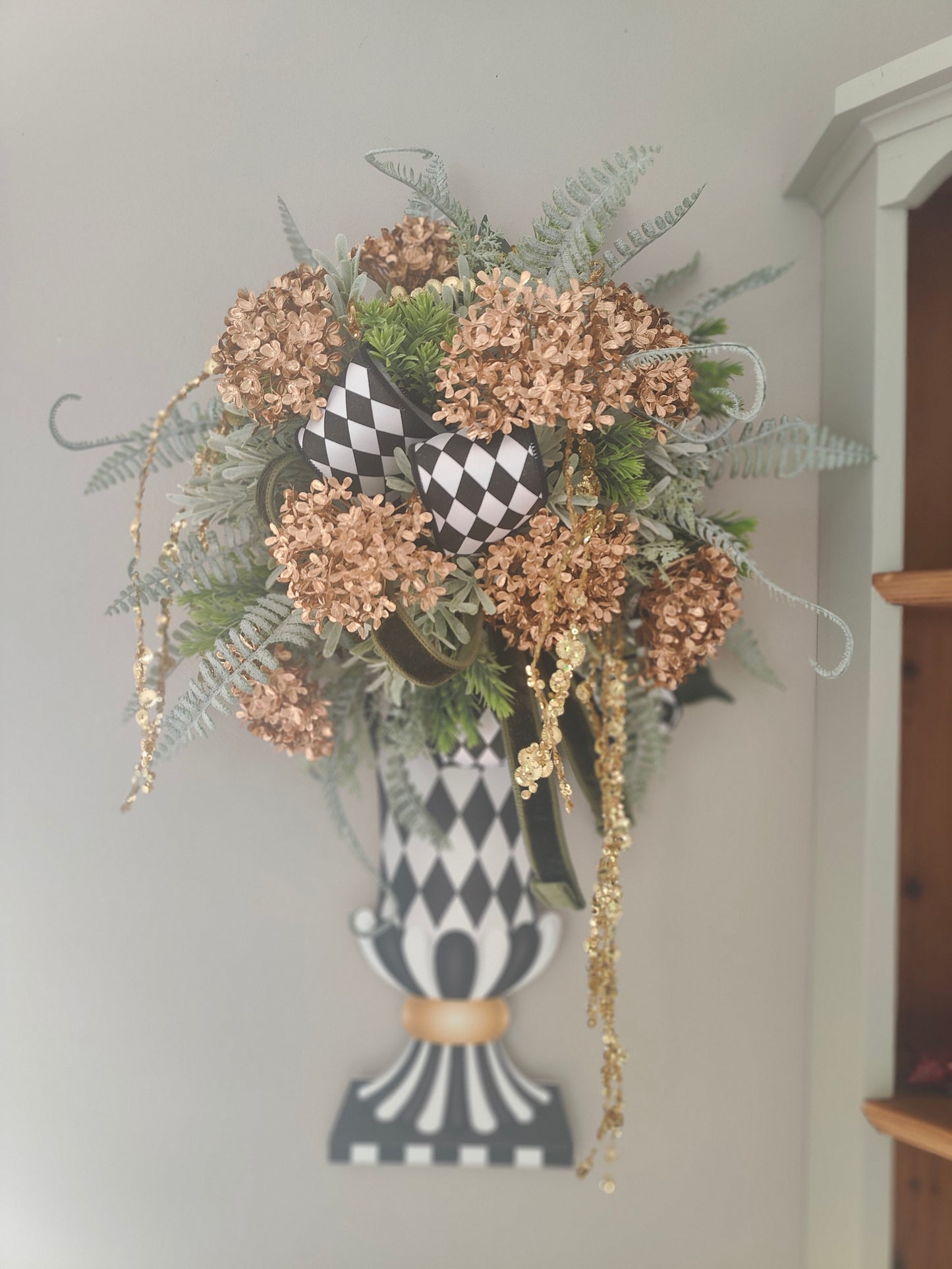 Vase wreath wall decor Mackenzie Childs style vibes Christmas swag
