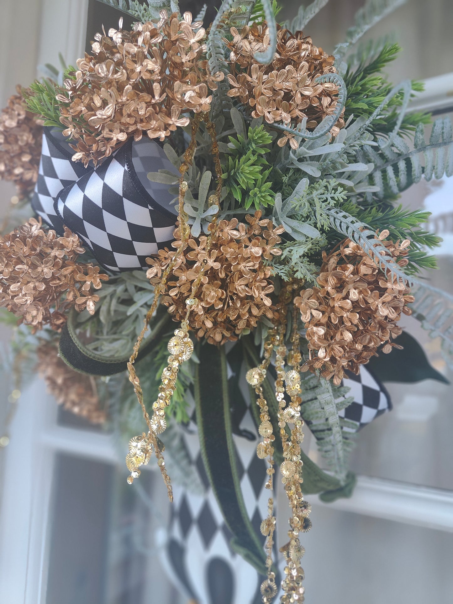 Vase wreath wall decor Mackenzie Childs style vibes Christmas swag