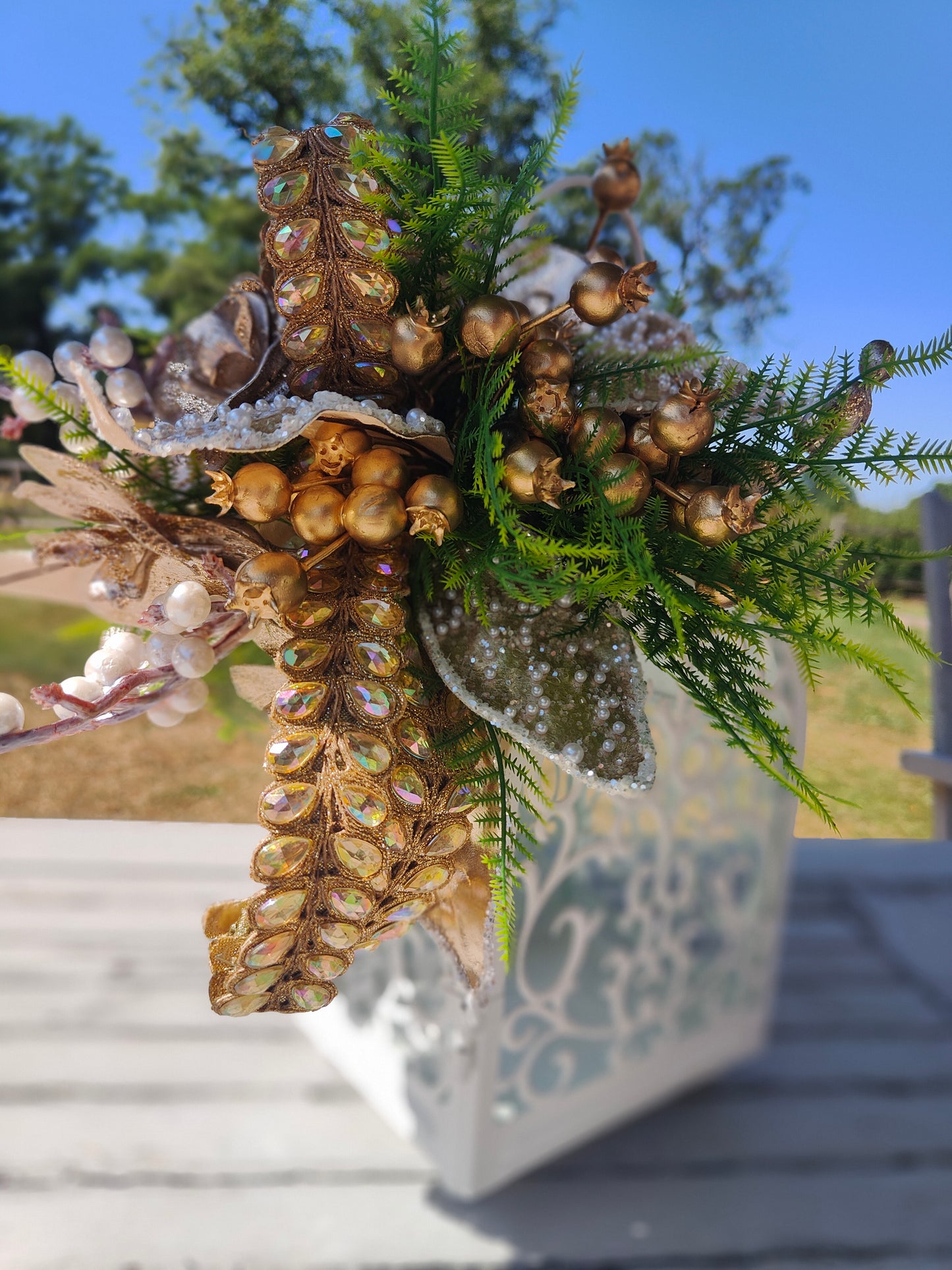 Lantern white and gold decorated tablecentre display. Gold and white lantern. Home decor arrangement