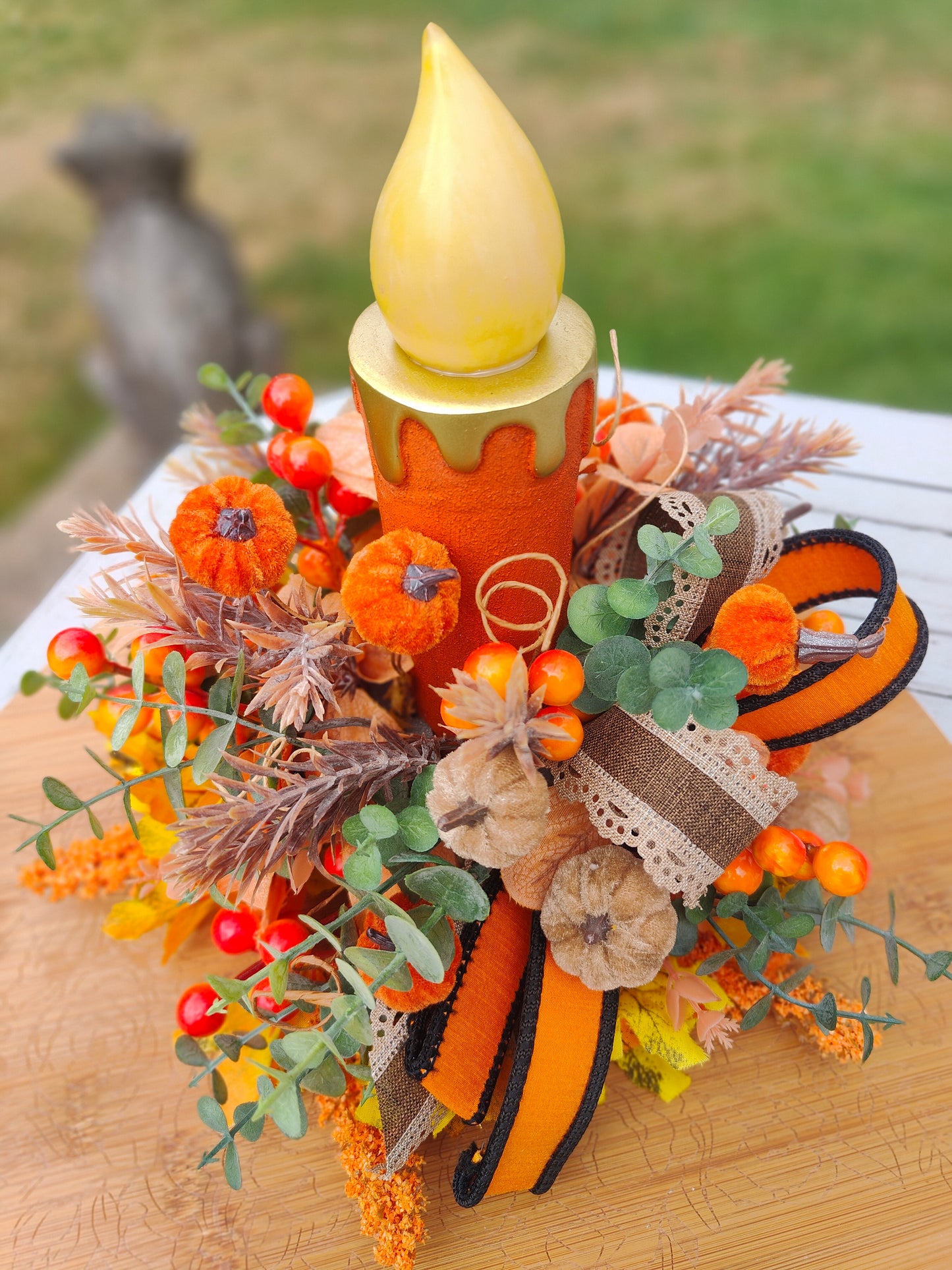 Autumn candle tablecentre arrangement lights up