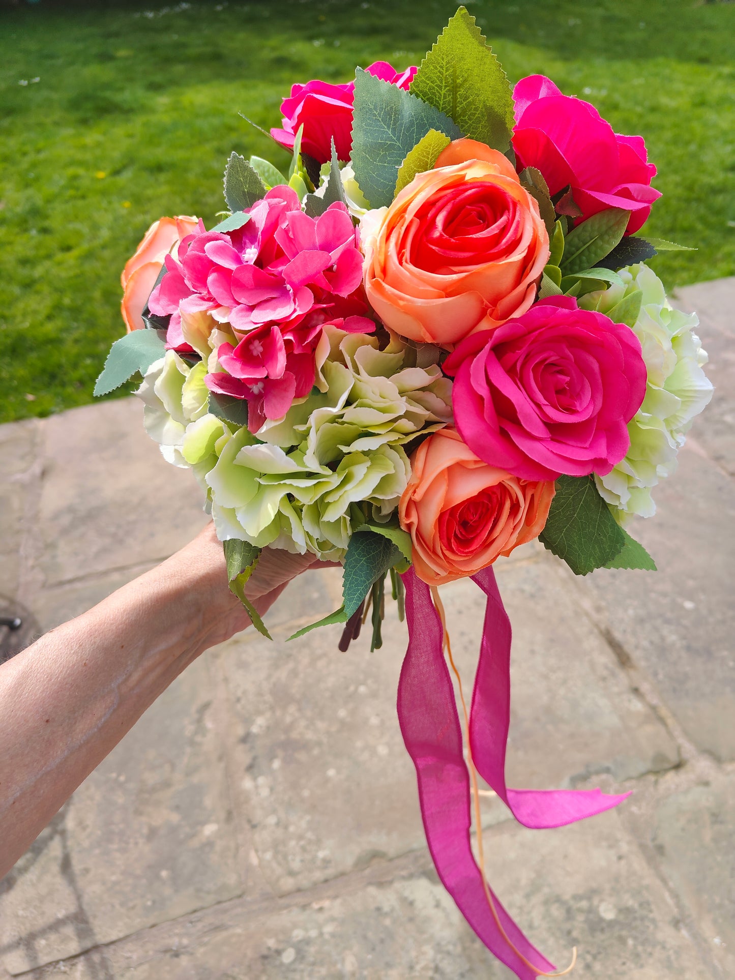Wedding bride bouquet hand-tied artificial flowers dark pink cerise, orange, pale light green