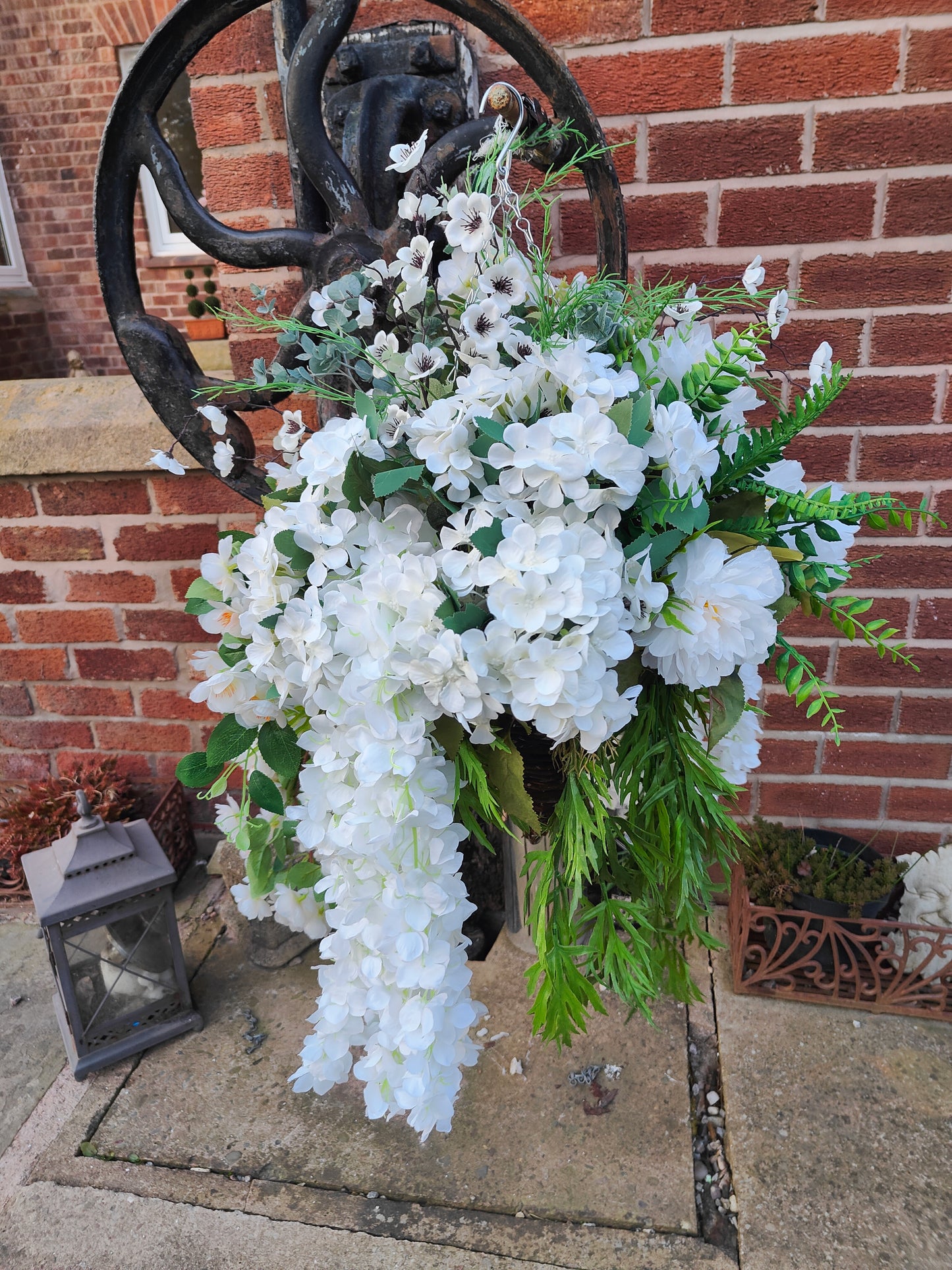 Hanging basket very large white artificial flowers cone
