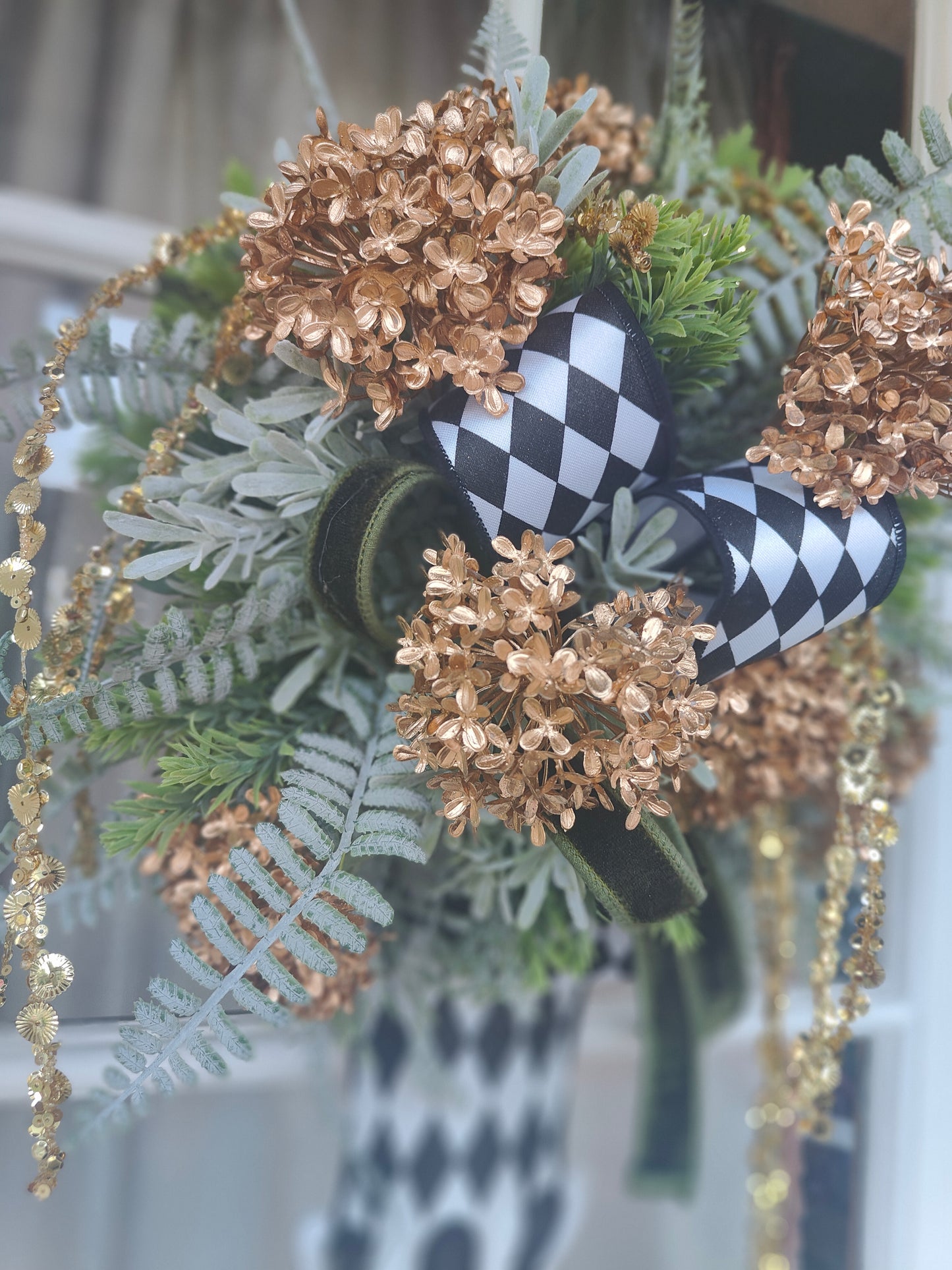 Vase wreath wall decor Mackenzie Childs style vibes Christmas swag