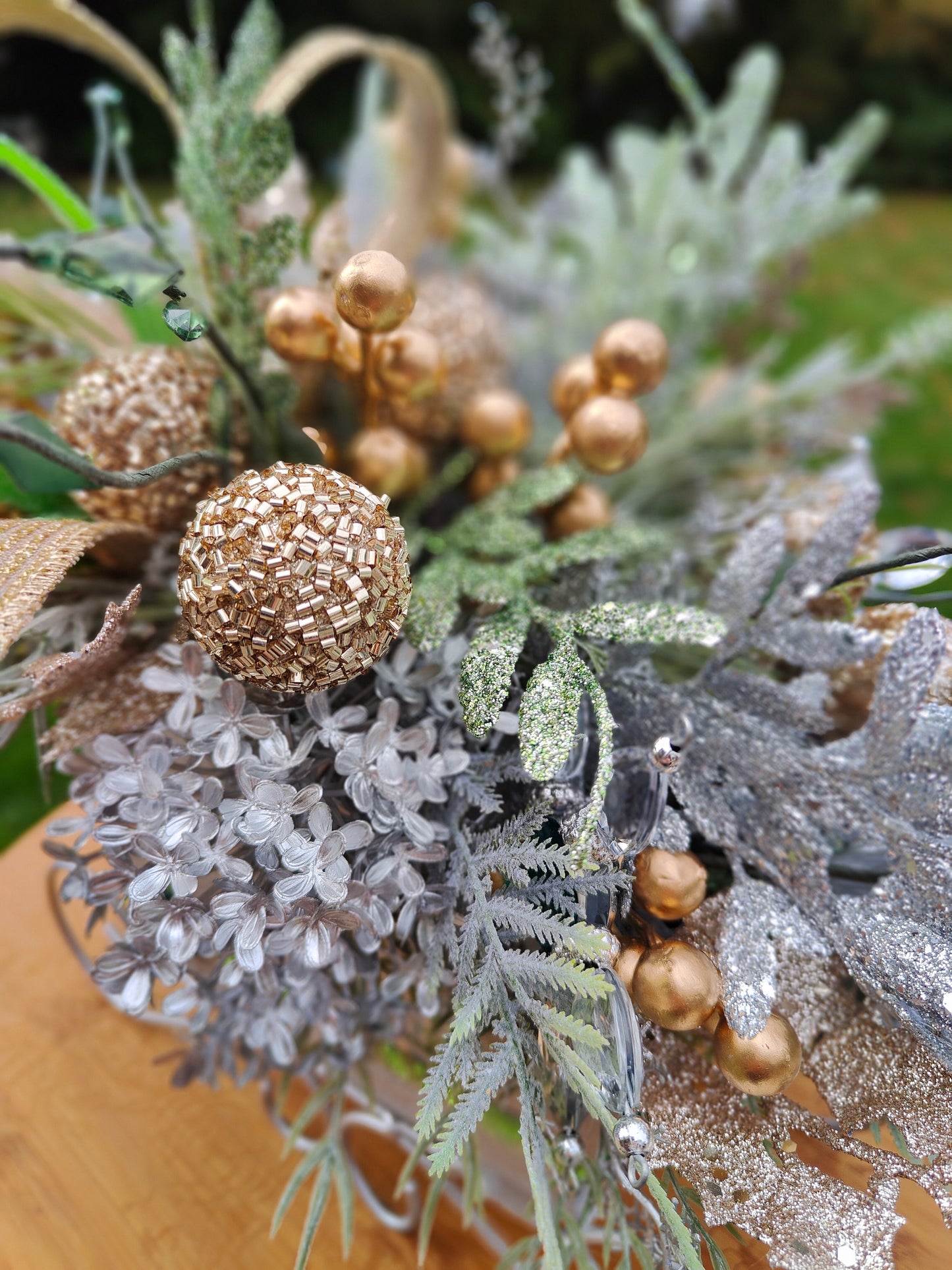 Christmas decoration sleigh gold silver tablecentre arrangement