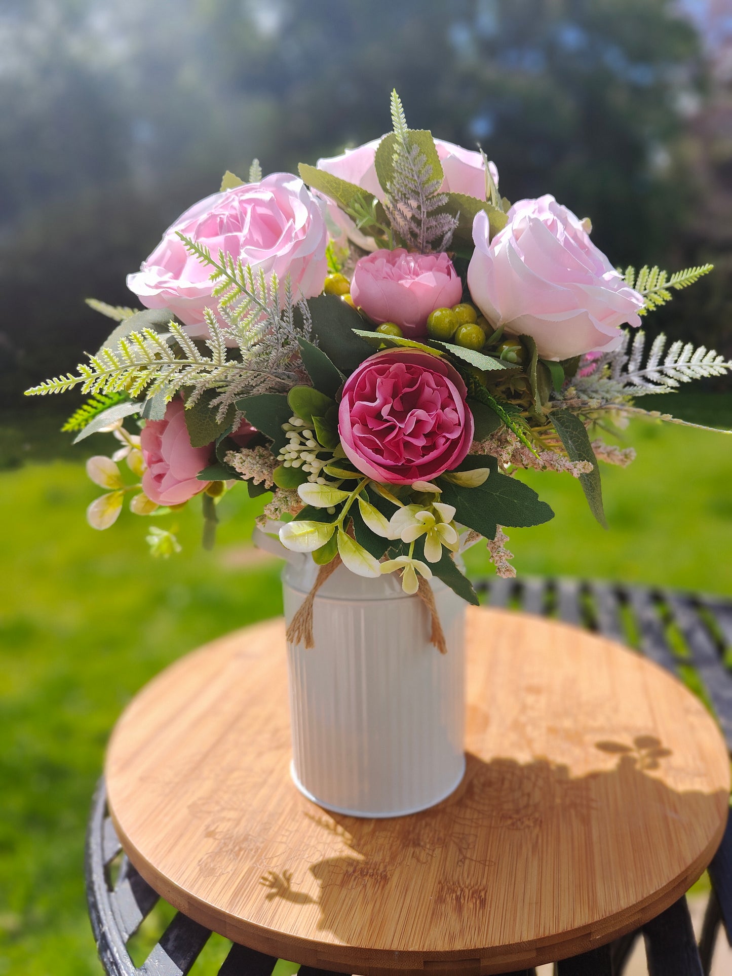 Pink flower arrangement milk churn centrepiece wedding flowers gift