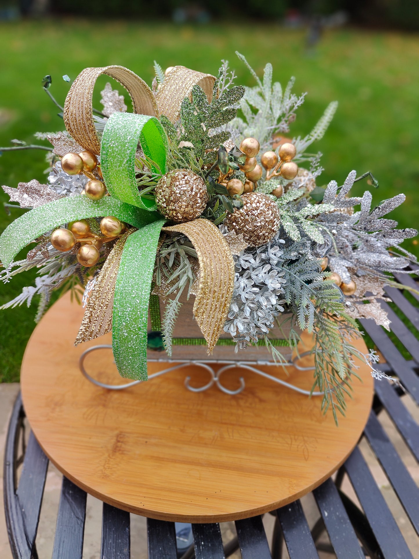 Christmas decoration sleigh gold silver tablecentre arrangement