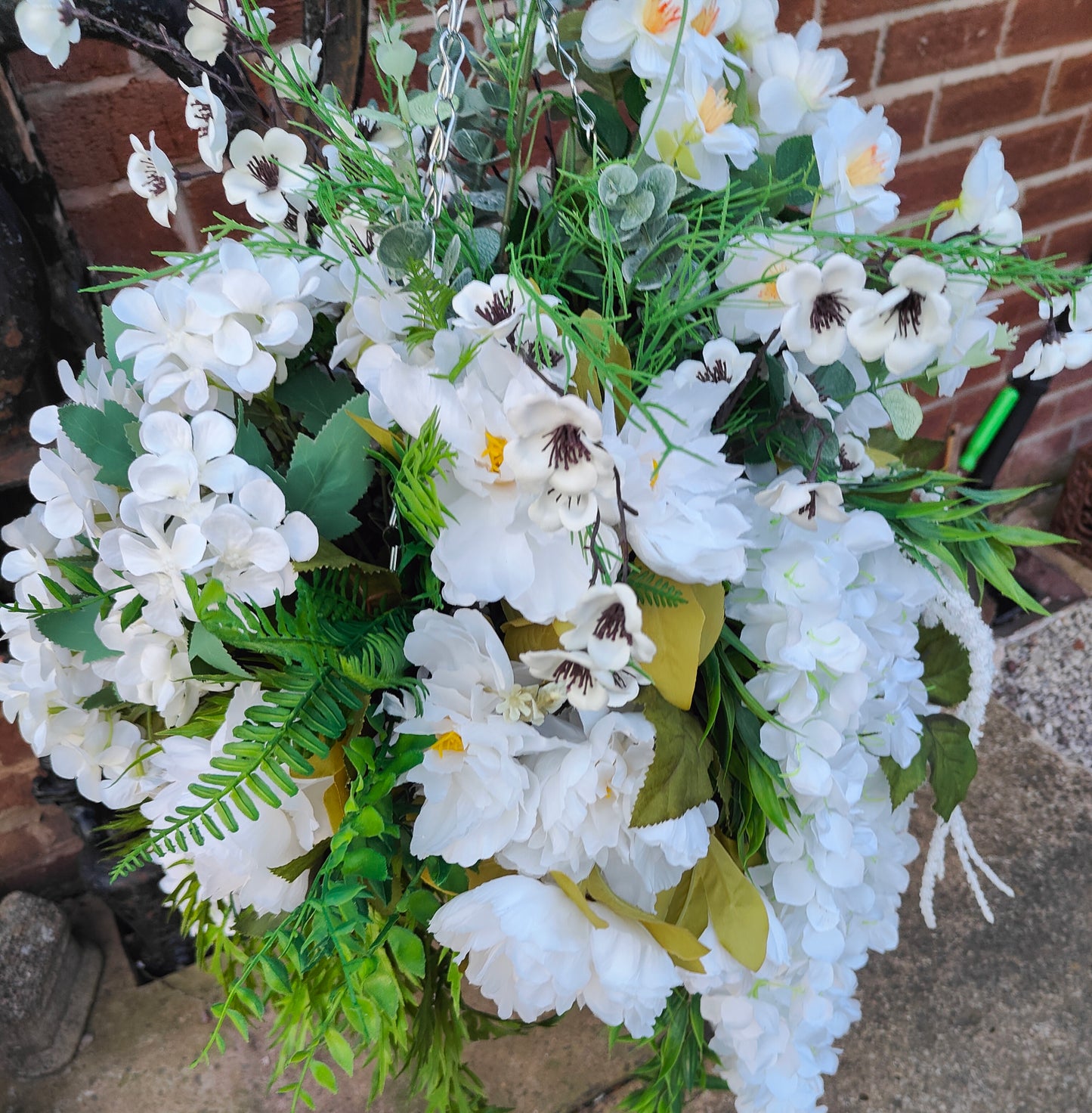 Hanging basket very large white artificial flowers cone
