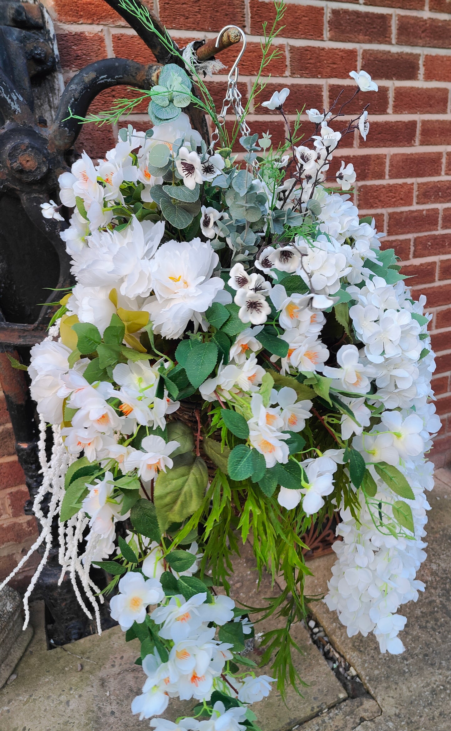 Hanging basket very large white artificial flowers cone