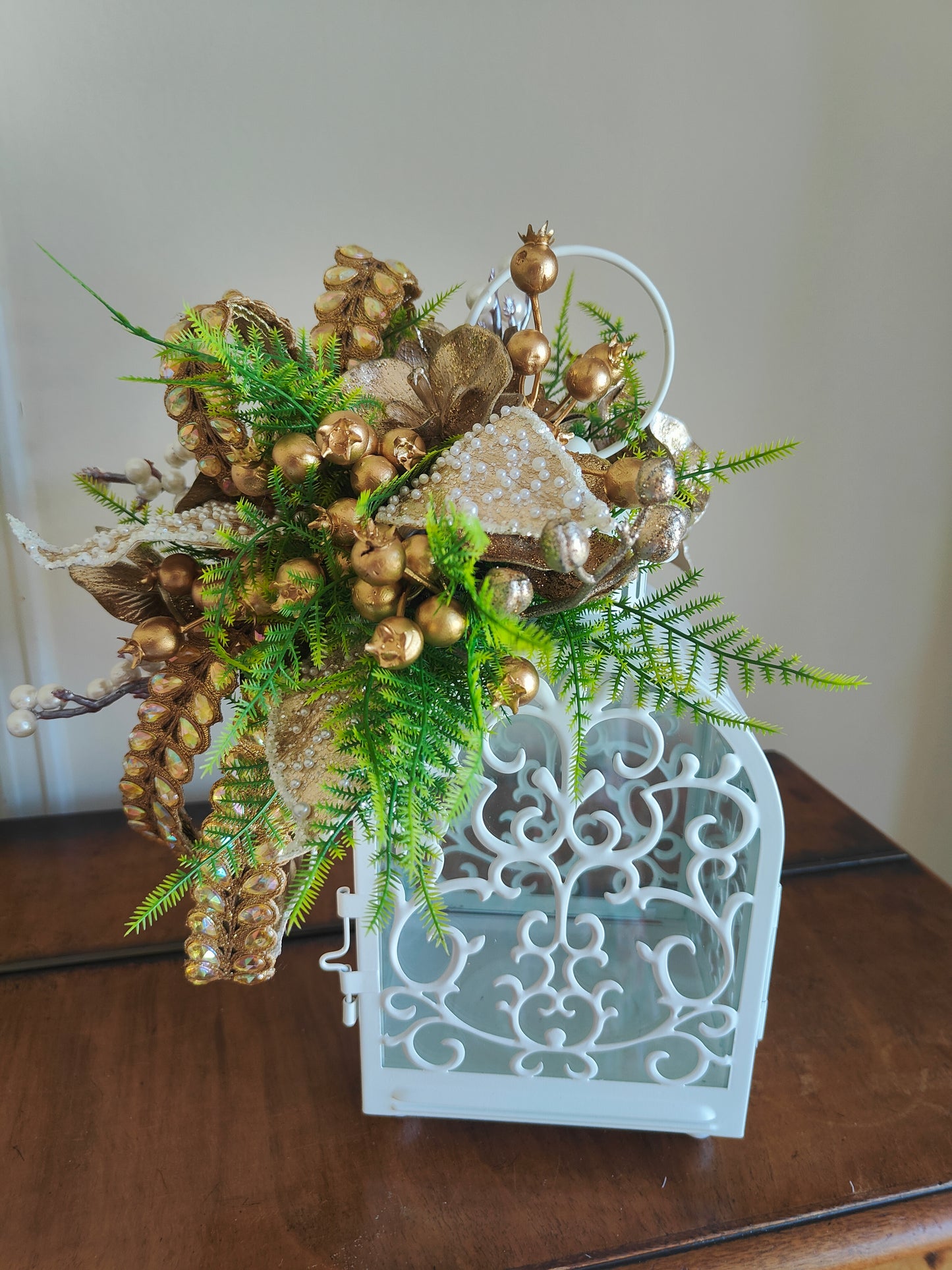 Lantern white and gold decorated tablecentre display. Gold and white lantern. Home decor arrangement