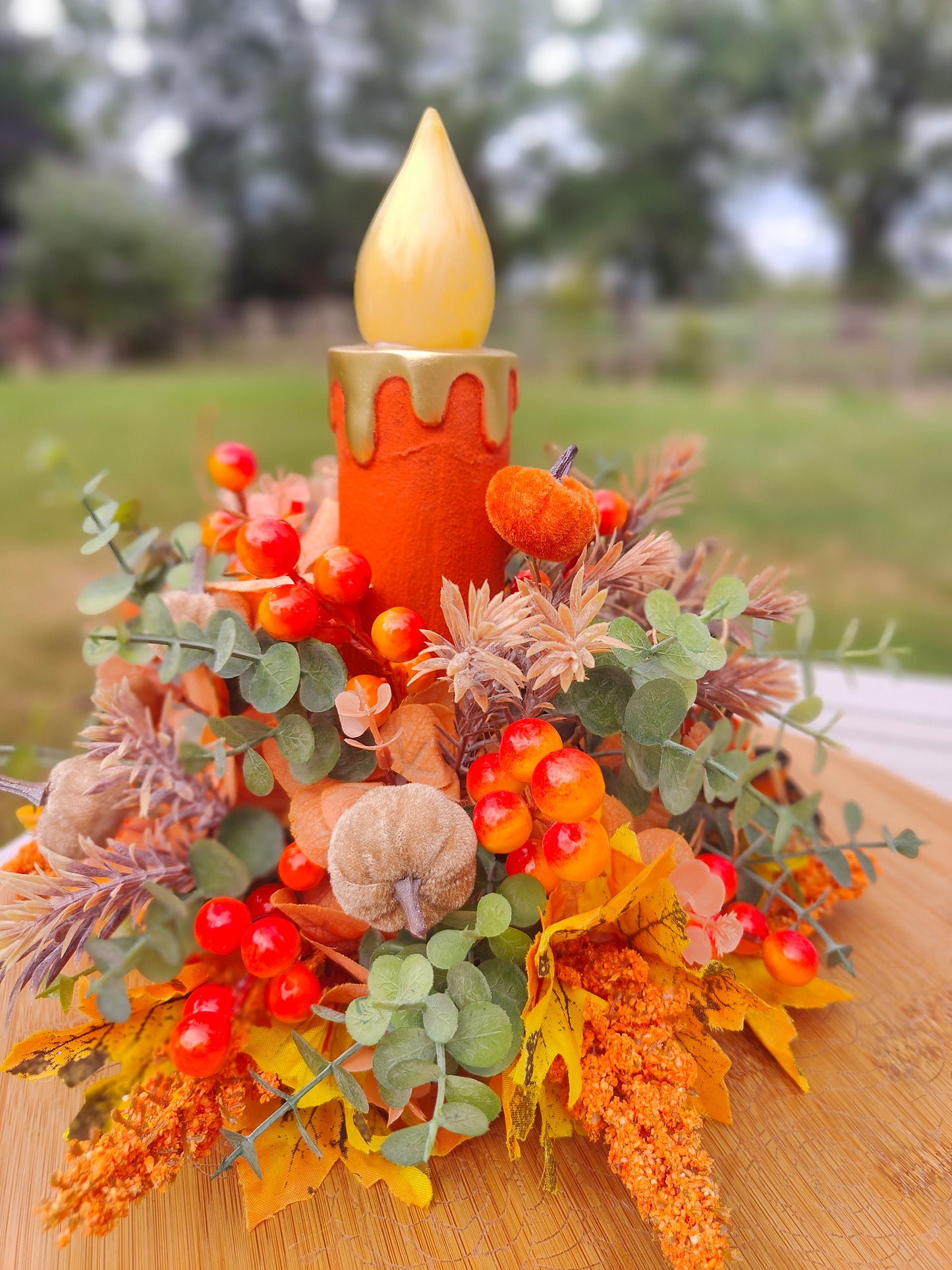 Autumn candle tablecentre arrangement lights up