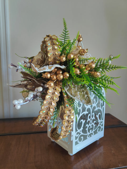 Lantern white and gold decorated tablecentre display. Gold and white lantern. Home decor arrangement