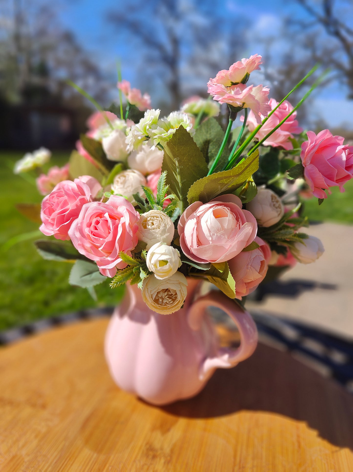 Flower arrangement artificial pink roses ranunculus in ceramic pink jug by Price & Kensington vintage