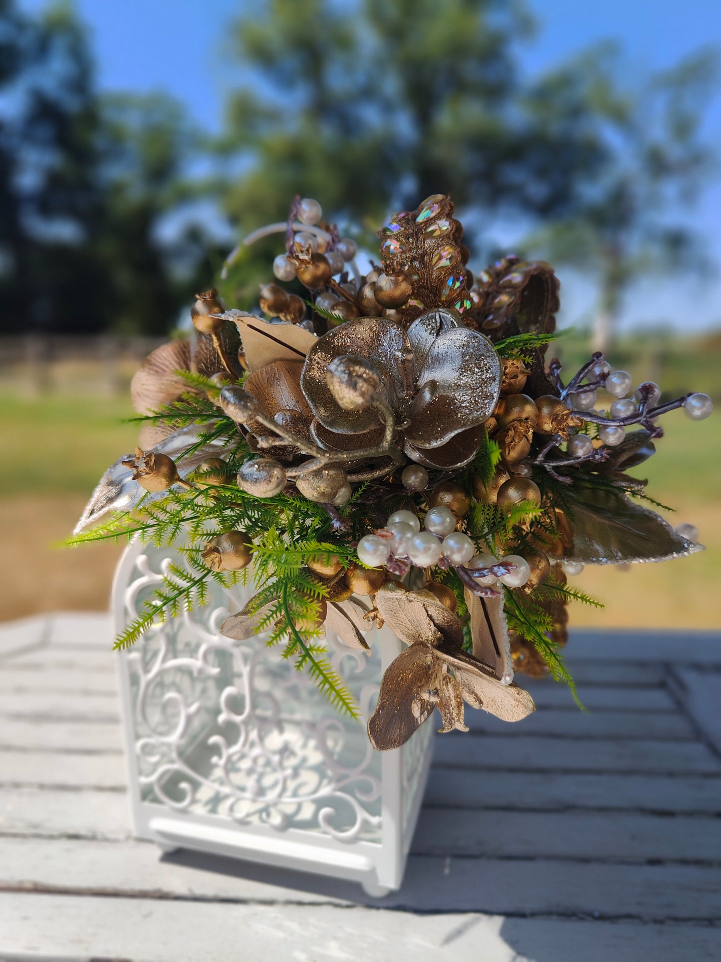 Lantern white and gold decorated tablecentre display. Gold and white lantern. Home decor arrangement