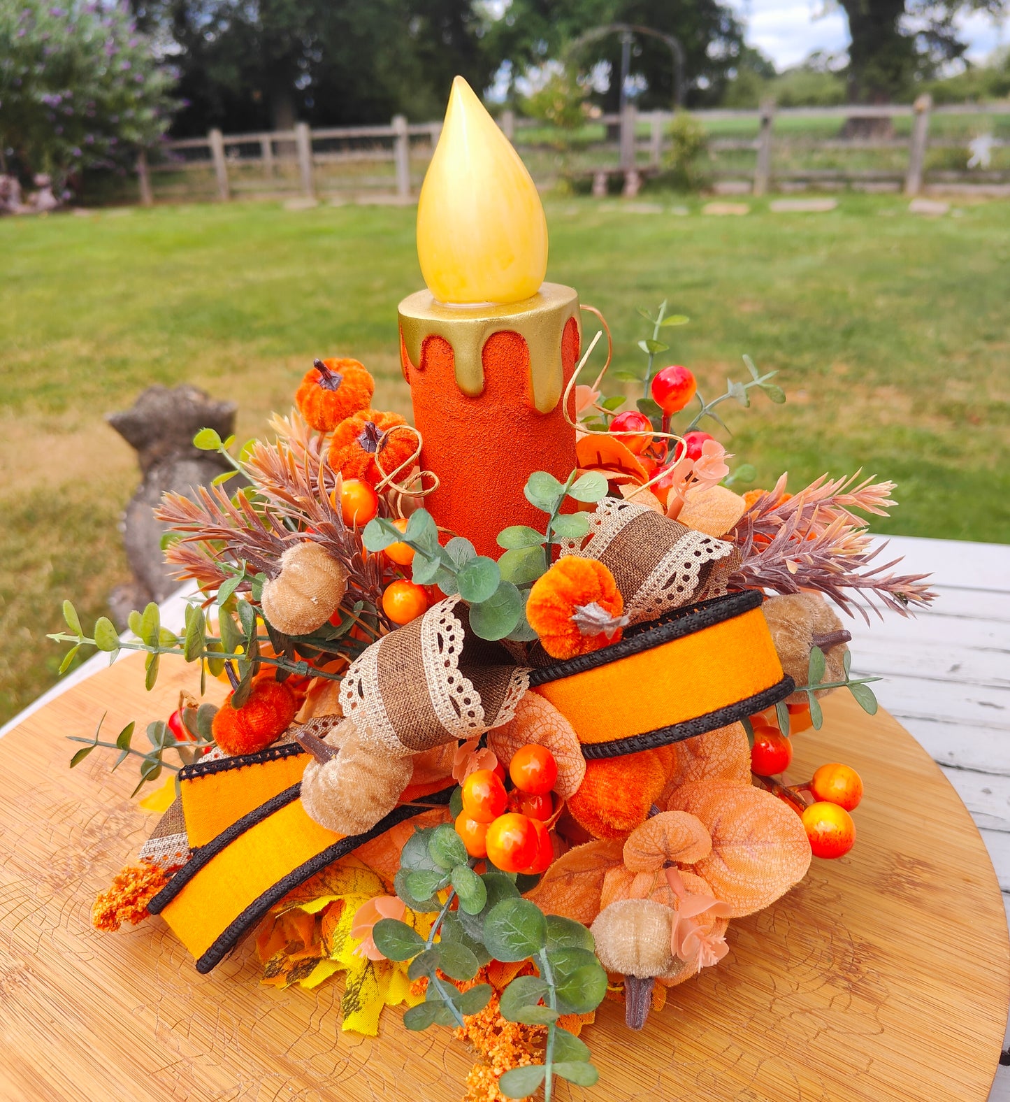 Autumn candle tablecentre arrangement lights up