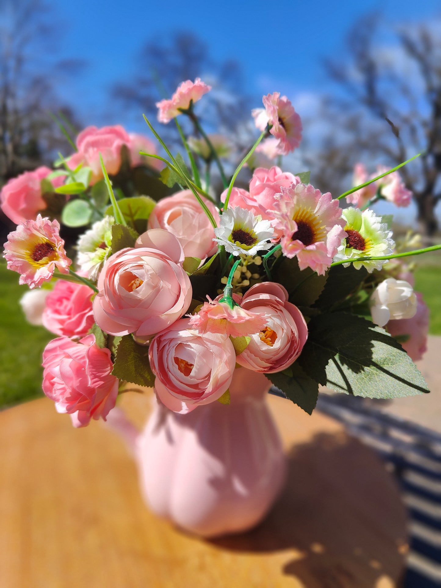 Flower arrangement artificial pink roses ranunculus in ceramic pink jug by Price & Kensington vintage